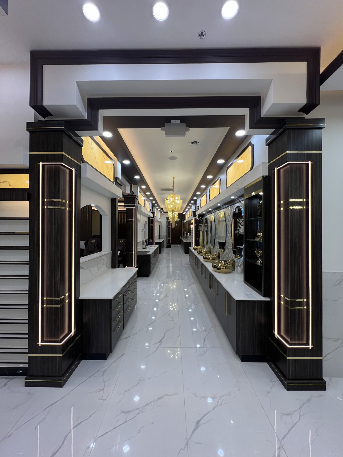 Manicure bar hall with coffered ceiling and gold mosaic accent wall